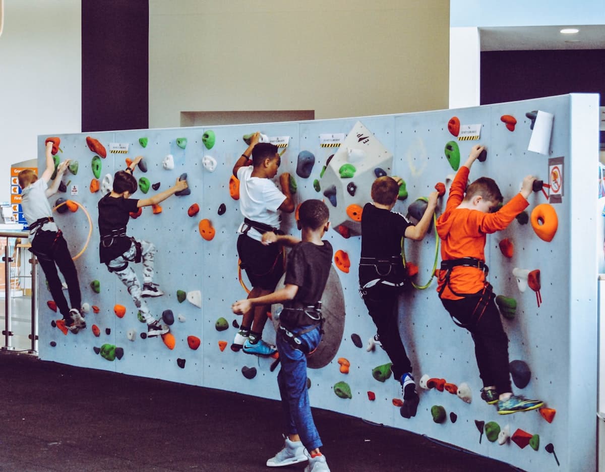 Kids climbing a rock wall together