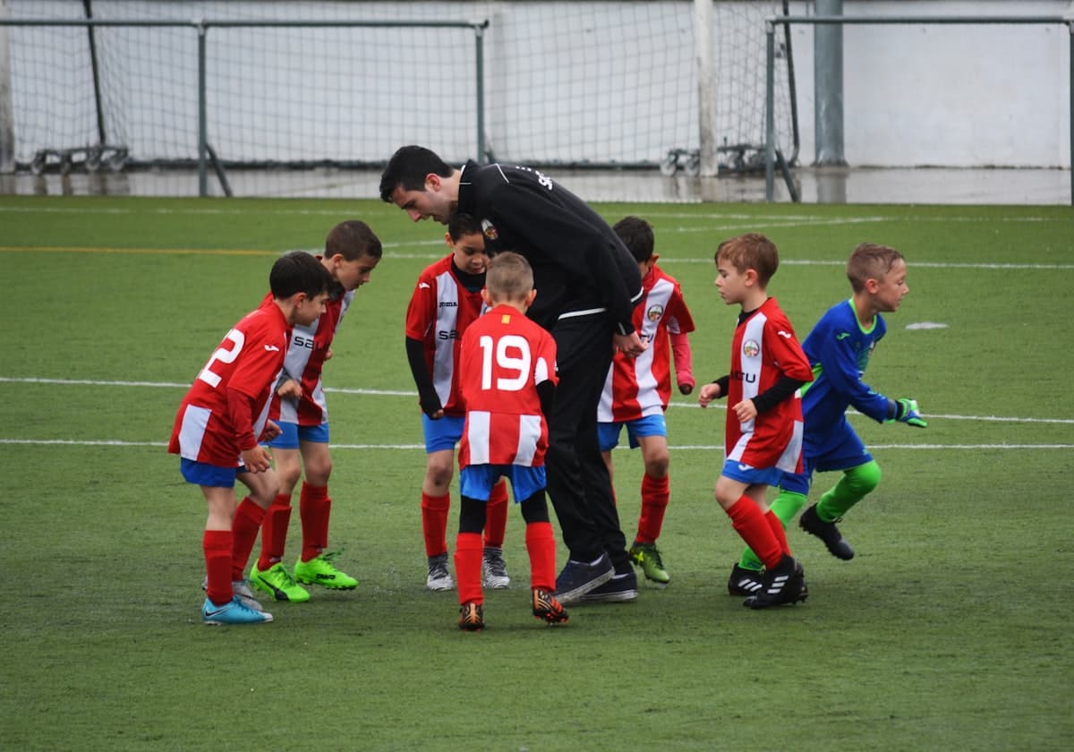 Coach working with a youth soccer team